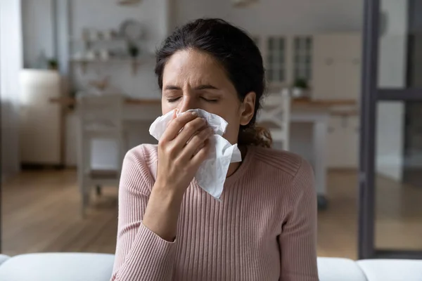 Ill latina lady catching cold blow nose in paper tissue — Stock Photo, Image