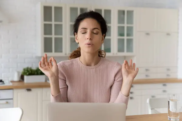 Calm hispanic female sit by pc with closed eyes meditate — Stock Photo, Image