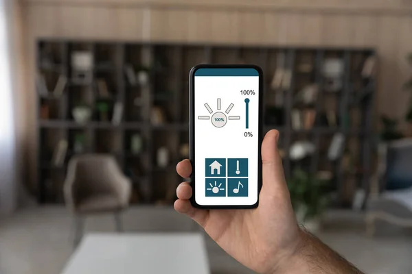 Close up of man use smart home application on cell
