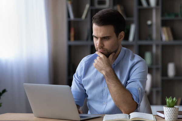 Thoughtful man use computer gadget making decision
