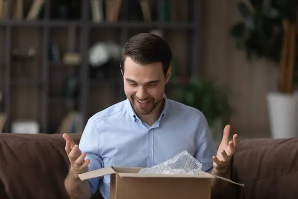 Excited man buyer overjoyed with good quality product — Stock Photo, Image