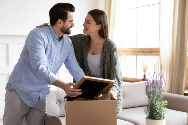 Happy couple renters settle in new home