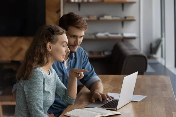 Work colleagues busy brainstorm at laptop in office — Stock Photo, Image