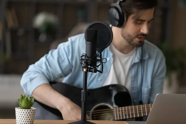 Close up professional microphone, man playing guitar, recording song — Stock Photo, Image