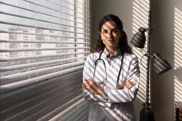 Headshot portrait of young hispanic female medical worker in office — Stock Photo, Image