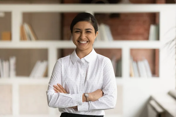 Head shot portrait smiling Indian businesswoman with arms crossed — Stock Photo, Image