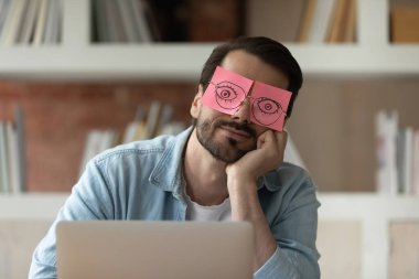Close up tired businessman with stickers on eyes sleeping clipart
