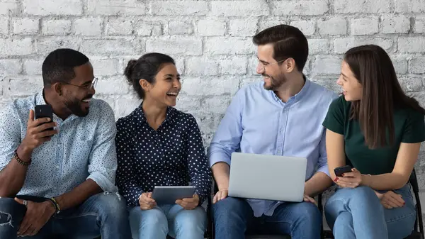 Happy diverse job candidates chatting and laughing while waiting — Stock Photo, Image