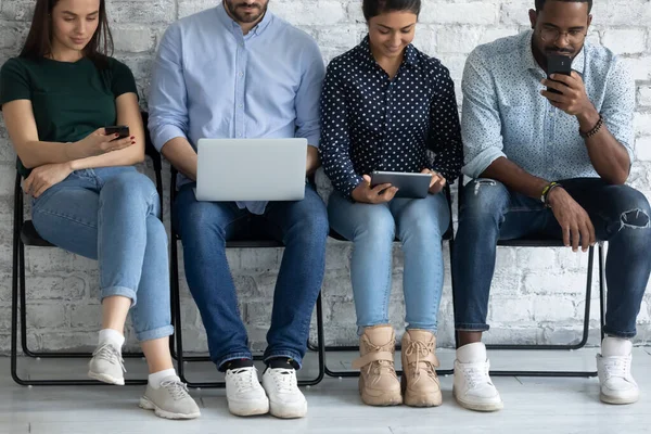 Diverse group of candidates sitting on chairs line — Stock Photo, Image