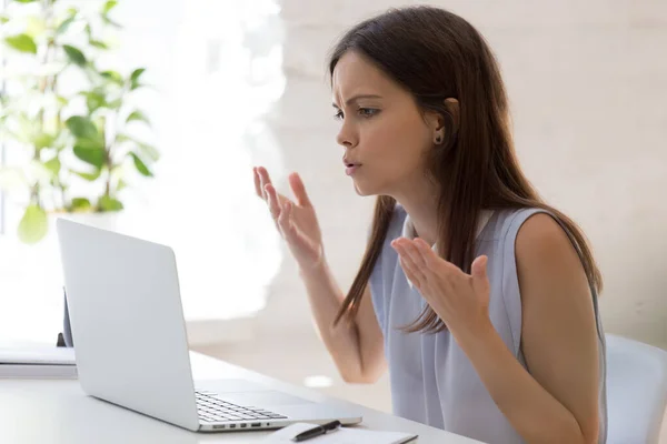 Unhappy millennial woman frustrated with computer problems — Stock Photo, Image