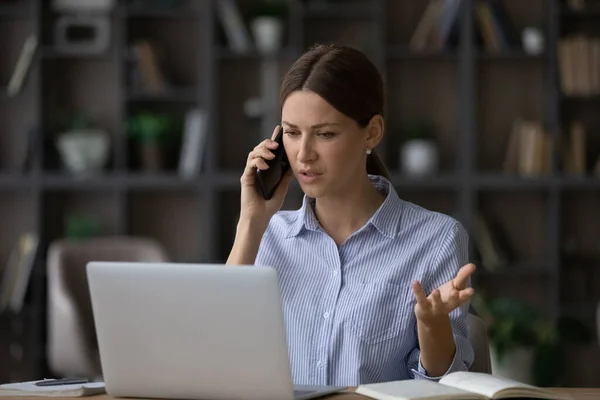 Worried young lady manager calling client to discuss contract breach — Stock Photo, Image