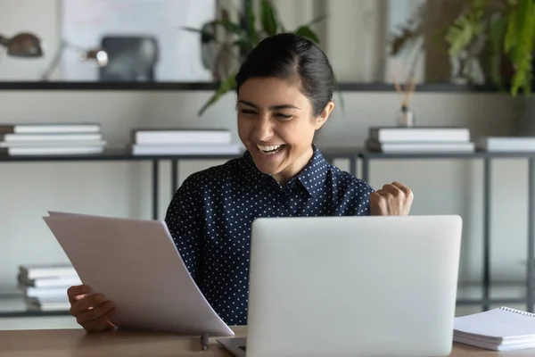 Overjoyed Indian female employee triumph with letter news — Stock Photo, Image