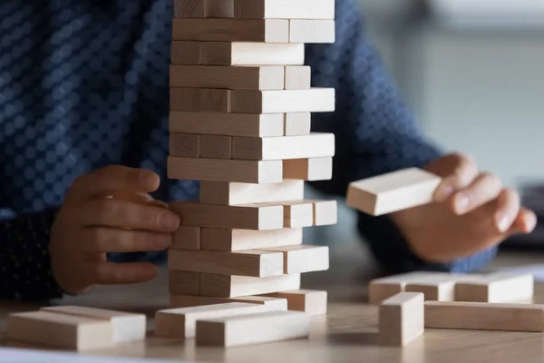 Close up of woman play wooden stack game — Stock Photo, Image