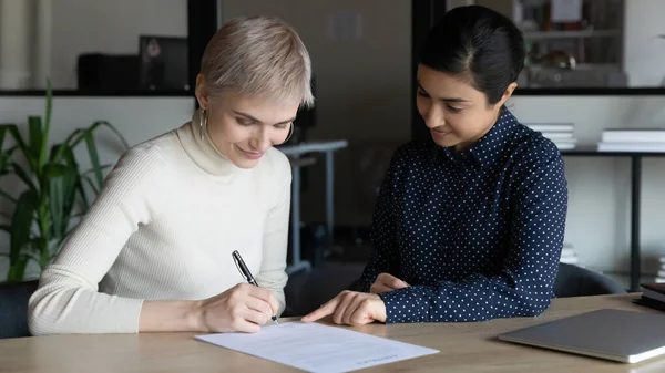 Happy multiracial businesswomen close deal at meeting — Stock Photo, Image