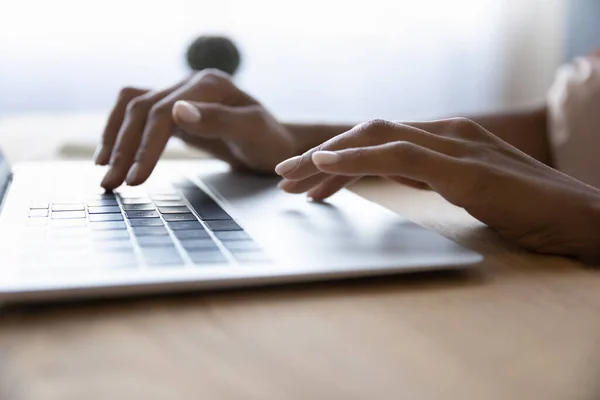 Close up young african woman typing message on laptop. — Stock Photo, Image