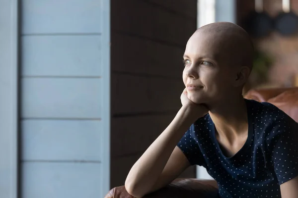 Thoughtful hairless ill woman fighting against cancer — Stock Photo, Image