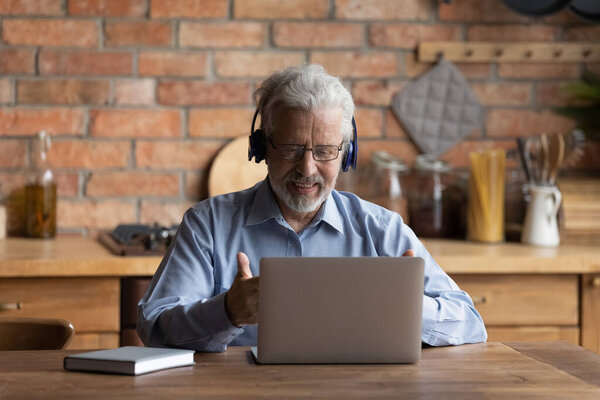 Older patient receive online counselling use laptop and videocall app