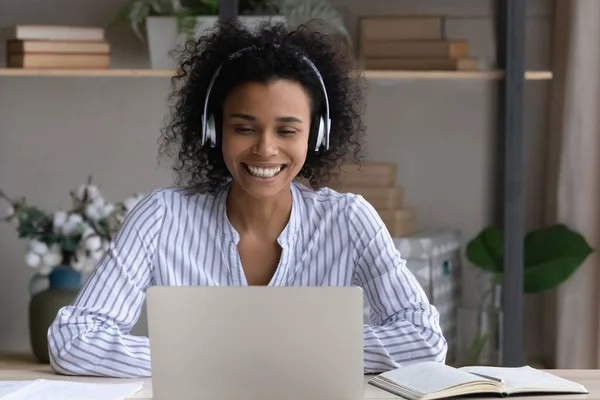 Smiling biracial female student talk on video call — Stock Photo, Image