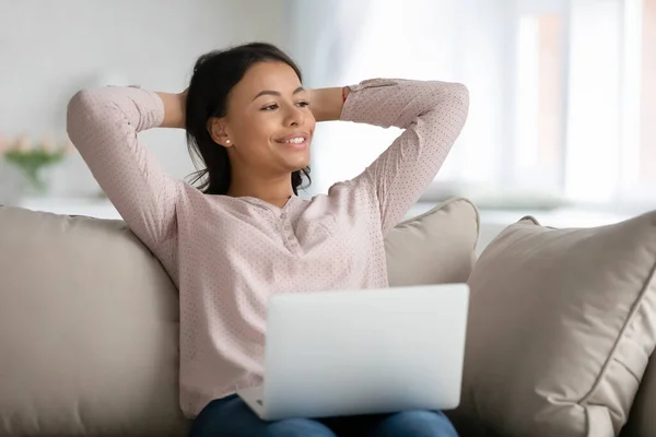 Happy relaxed female student, freelancer, customer relaxing on couch — Stock Photo, Image