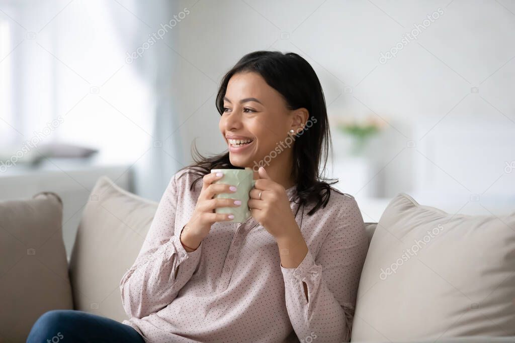 Happy black woman enjoying break for leisure at home