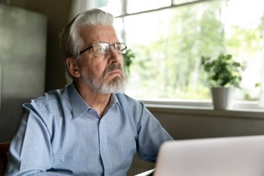 Pensive old man look in distance thinking pondering