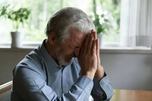 Unhappy old man cry feeling distressed at home — Stock Photo, Image