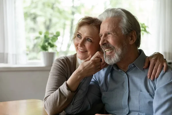 Smiling old couple hug dreaming of healthy future — Stock Photo, Image