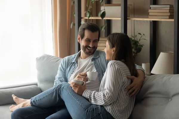 Relaxed happy family couple enjoying trusted conversation at home. — Stock Photo, Image