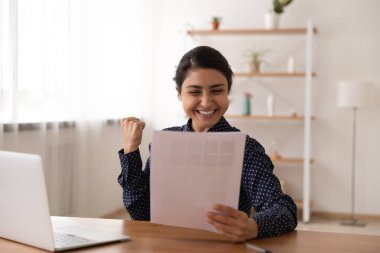Excited Indian woman read good news in letter