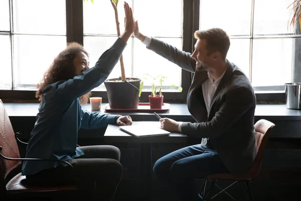 Happy young african american man giving high five to partner. — Stock Photo, Image