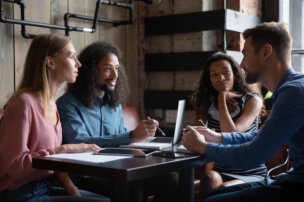Motivated happy young mixed race employees working together in cafe. — Stock Photo, Image