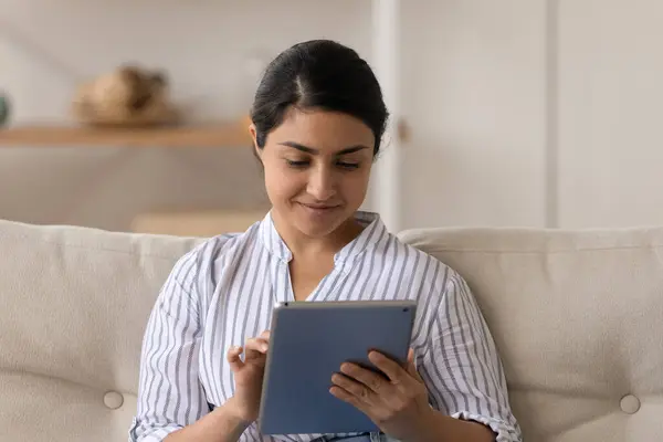 Happy Indian woman use tablet speak on webcam call — Stock Photo, Image