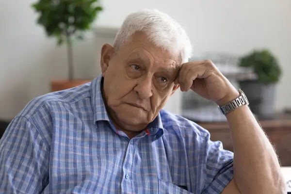 Upset old man look in distance feeling lonely — Stock Photo, Image