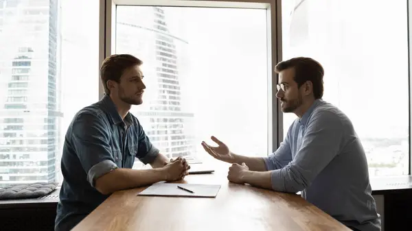 Two business people talking at interview meeting. — Stock Photo, Image