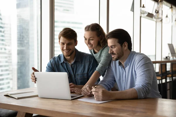 Happy three teammates working together on online project. — Stock Photo, Image