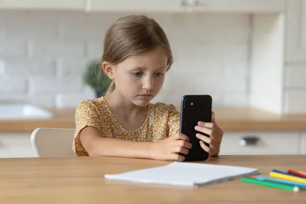 Little preschool 6s child girl using cellphone. — Stock Photo, Image
