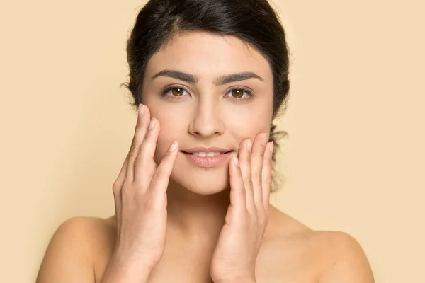 Portrait of Indian woman satisfied with healthy face skin — стоковое фото