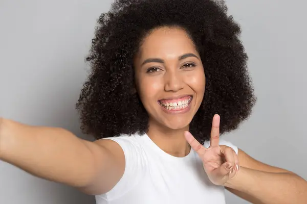 Smiling African American woman take self-portrait picture — Stock Photo, Image