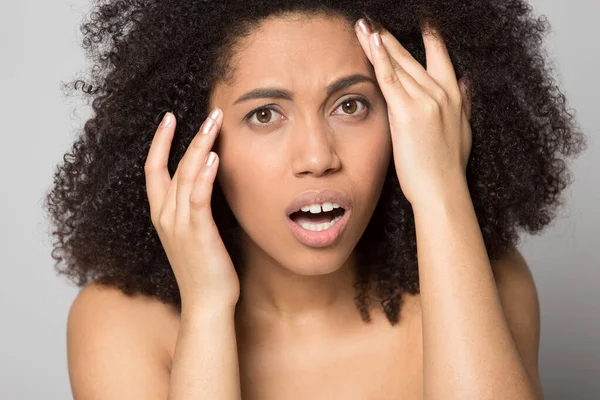 Unhappy African American woman worry about face wrinkles — Stock Photo, Image