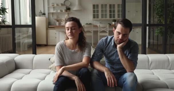 Stressed unhappy couple parents irritated by naughty kids. — Stock Video