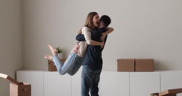 Homeowner family cuddling swirling looking overjoyed celebrate moving day — Stock Video