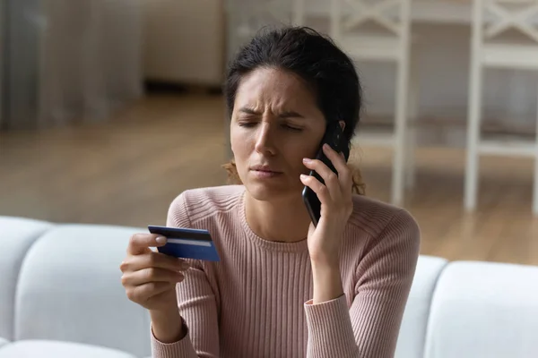 Dissatisfied young female hispanic client calling bank support. — Stock Photo, Image