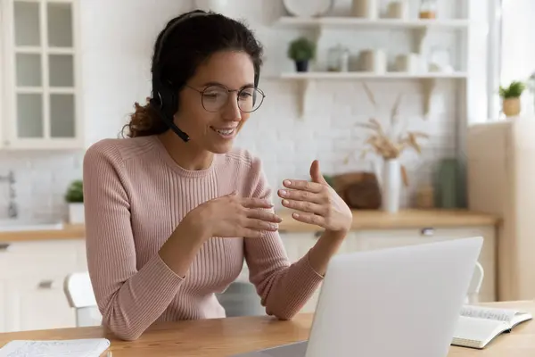 Smiling businesswoman in headset holding video call. — Stock Photo, Image