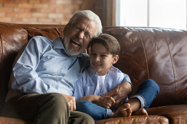 Happy grandpa having fun with cute preschooler grandson — Stock Photo, Image