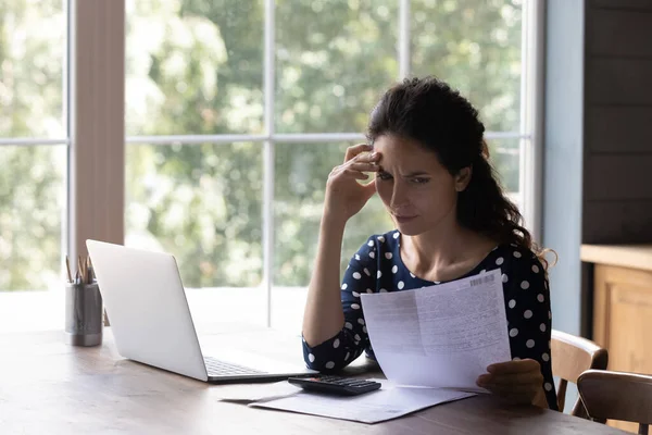 Concern housewife checking utility bill, seeing mistaken too high costs — Stock Photo, Image