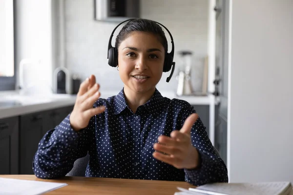 Happy funny Indian student wearing headphones looking at webcam — Stock Photo, Image