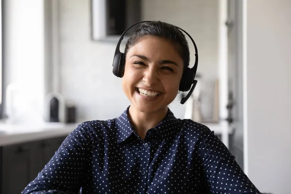 Happy funny Indian student wearing headphones and microphone — Stock Photo, Image