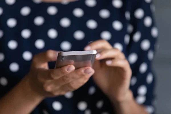 Close up of cellphone in human hands. Woman holding smartphone — стоковое фото