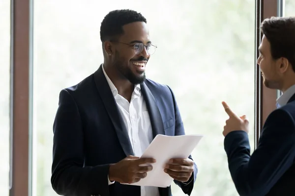 Happy diverse corporate business coworkers standing and chatting — Stock Photo, Image