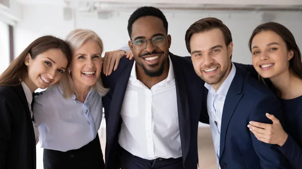 Happy multiethnic different aged business group celebrating corporate success — Stock Photo, Image